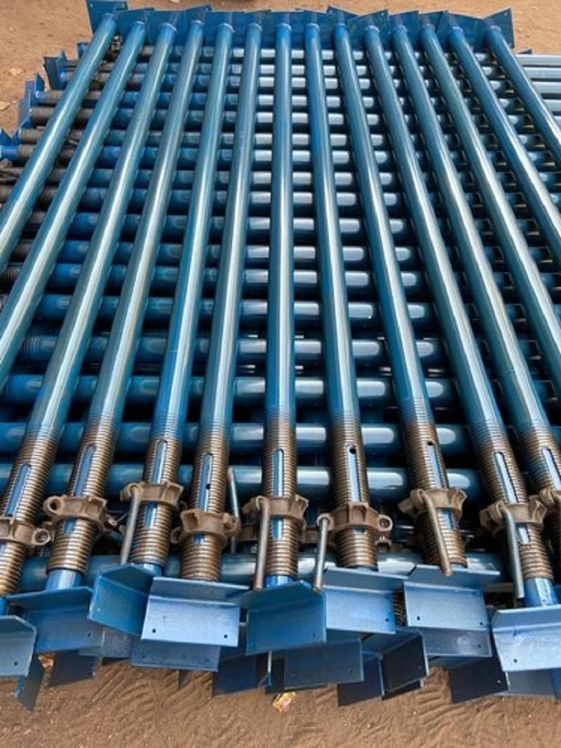 Blue adjustable steel props stacked at the Sohal Steel yard